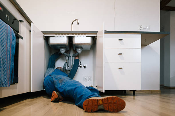 Professional Plumbing technician working in Cumming, IA